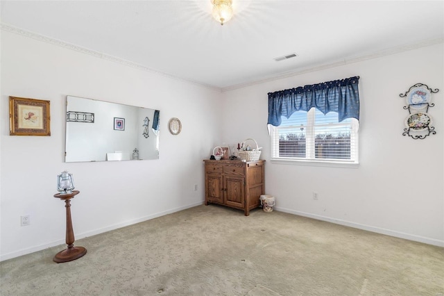 carpeted bedroom with baseboards, visible vents, and ornamental molding