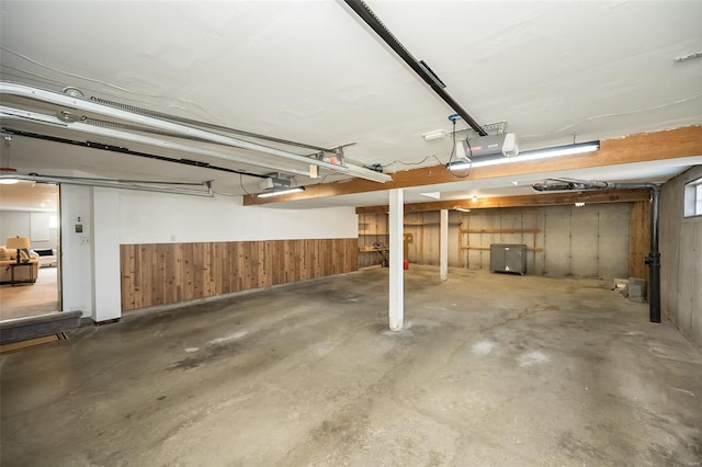 garage with a wainscoted wall and wooden walls