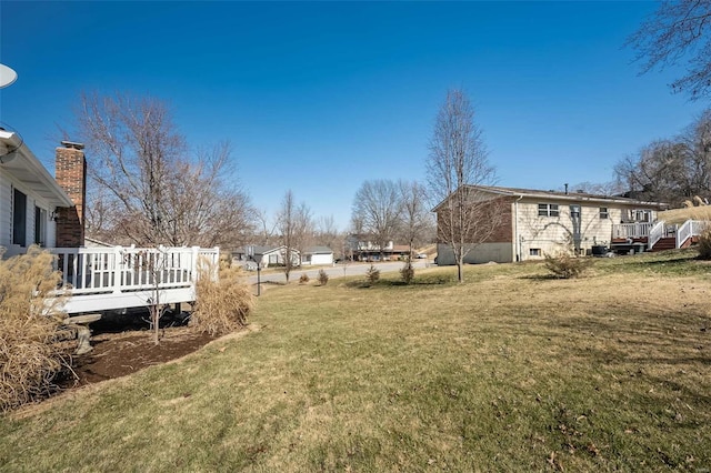 view of yard with a wooden deck