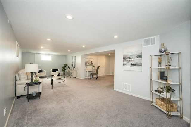 carpeted living room with recessed lighting, visible vents, and baseboards