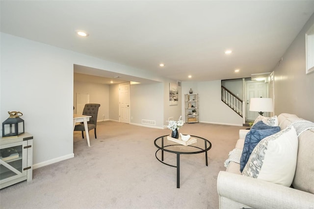 living area featuring recessed lighting, light colored carpet, stairway, and baseboards