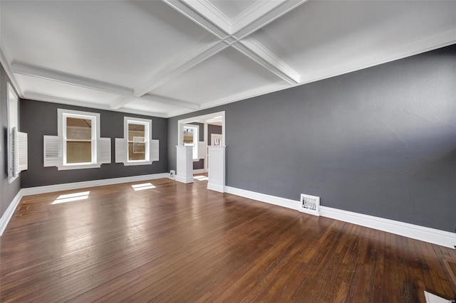 unfurnished room with hardwood / wood-style flooring, baseboards, visible vents, and coffered ceiling