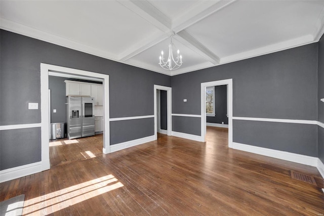 unfurnished room with a chandelier, coffered ceiling, baseboards, beamed ceiling, and wood-type flooring