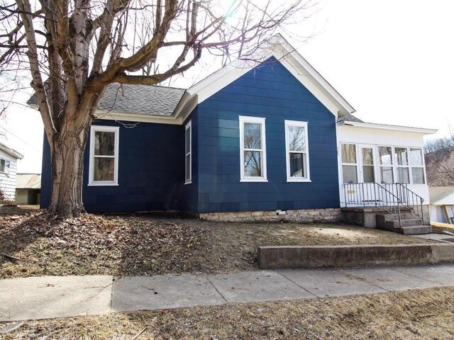 view of home's exterior featuring a shingled roof