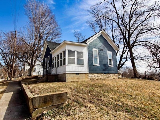 view of property exterior with crawl space