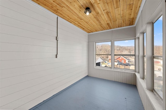 unfurnished sunroom featuring wood ceiling