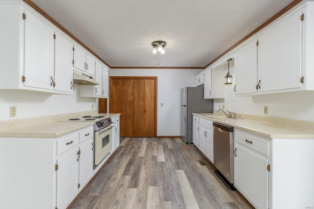 kitchen with stainless steel appliances, a sink, white cabinets, and under cabinet range hood