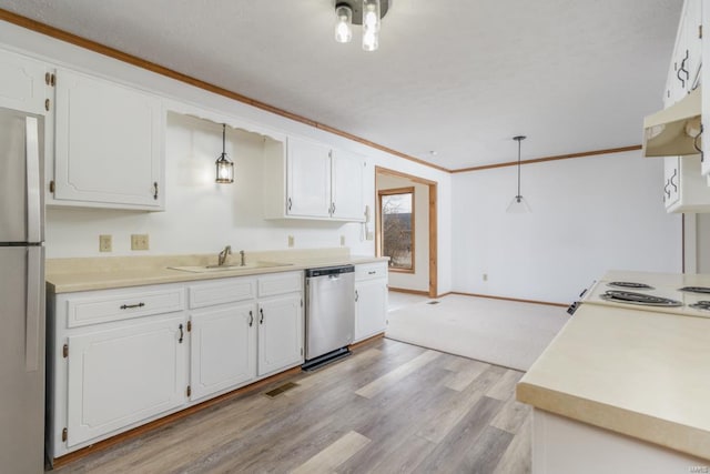 kitchen with appliances with stainless steel finishes, a sink, white cabinetry, and under cabinet range hood