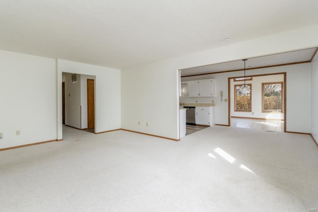 unfurnished living room with baseboards and light colored carpet