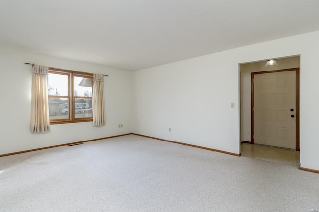 empty room with light carpet and baseboards