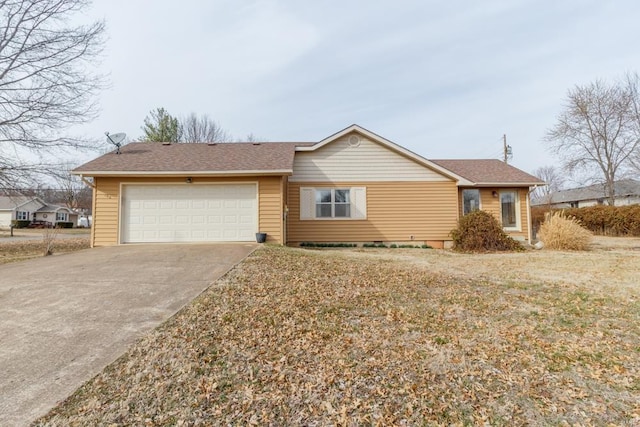 ranch-style house featuring driveway, a shingled roof, and a garage