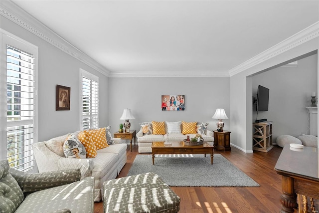 living room with baseboards, wood finished floors, and ornamental molding