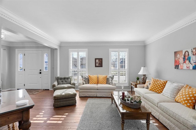 living room featuring wood-type flooring and ornamental molding