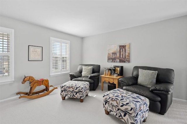 sitting room with carpet and baseboards