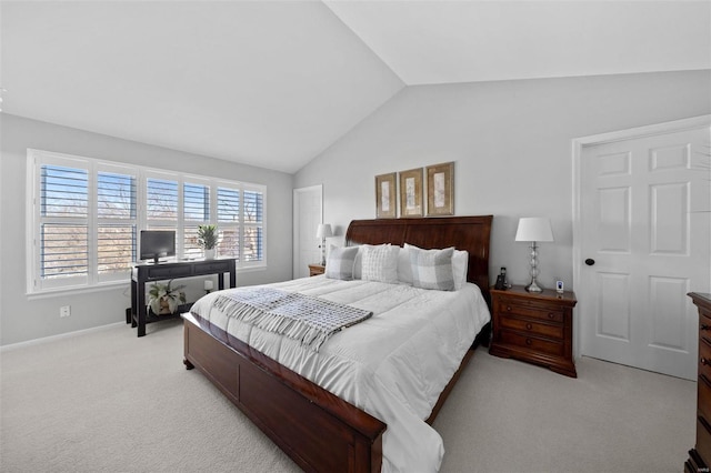 bedroom featuring light carpet, baseboards, and vaulted ceiling