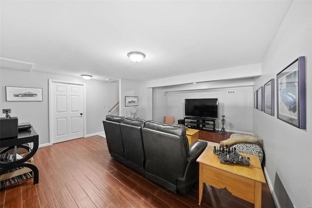 living area featuring wood finished floors and baseboards