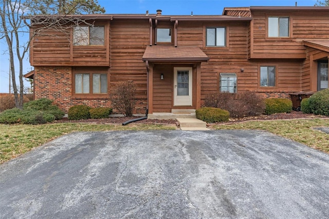 view of front of house featuring brick siding