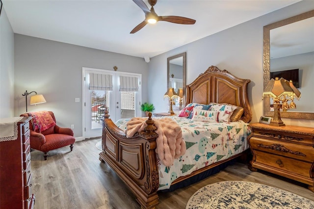 bedroom with wood finished floors, a ceiling fan, baseboards, access to exterior, and french doors