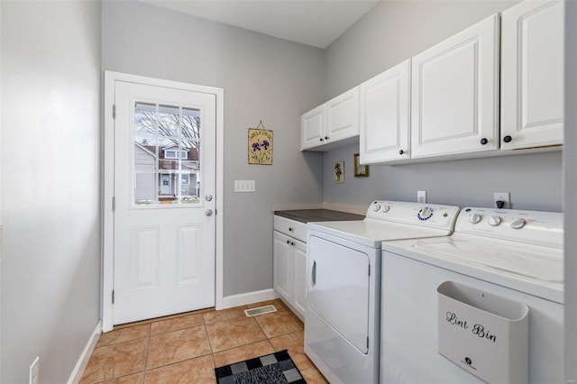 clothes washing area with cabinet space, visible vents, light tile patterned flooring, washer and dryer, and baseboards