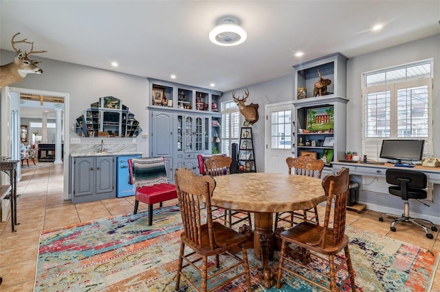 dining room with light tile patterned floors, plenty of natural light, wine cooler, and recessed lighting