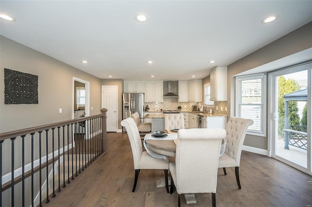 dining room featuring baseboards, washer / clothes dryer, dark wood finished floors, and recessed lighting