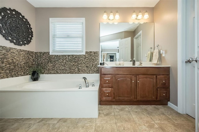 full bath with tile patterned flooring, a garden tub, and vanity