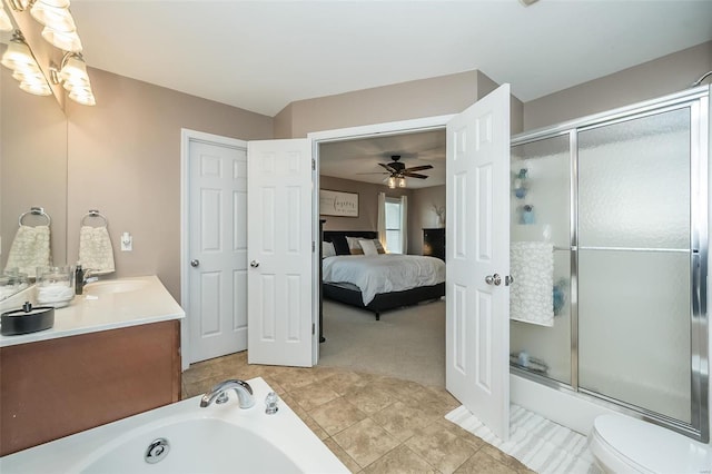 full bath featuring tile patterned floors, toilet, vanity, ensuite bath, and ceiling fan with notable chandelier