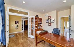 office space with recessed lighting, french doors, and wood finished floors