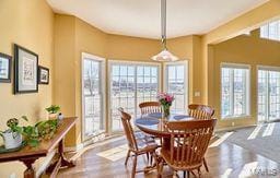 dining space featuring wood finished floors