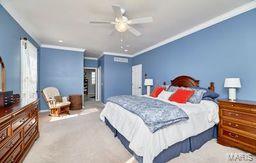 bedroom featuring ceiling fan, carpet, and ornamental molding