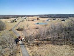 birds eye view of property featuring a rural view