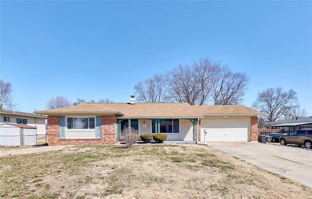 ranch-style home with an attached garage, fence, brick siding, and driveway