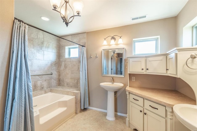 full bathroom featuring a sink, baseboards, visible vents, and shower / tub combo with curtain