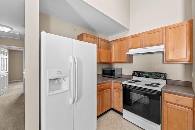 kitchen with electric stove, white refrigerator with ice dispenser, stainless steel microwave, and under cabinet range hood