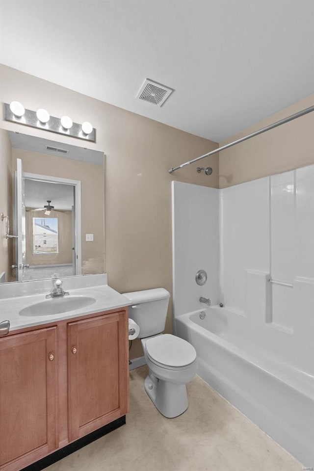 bathroom featuring visible vents, vanity, toilet, and shower / bathtub combination