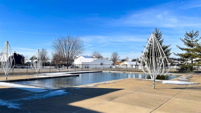 community pool featuring fence