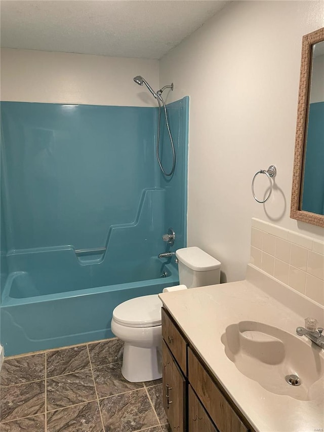 full bathroom with toilet, bathtub / shower combination, and vanity