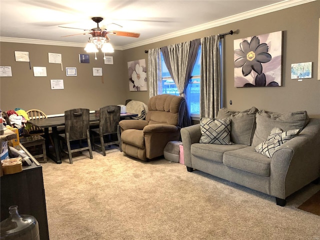 living area with ceiling fan, carpet, and crown molding