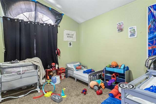 bedroom featuring lofted ceiling and carpet flooring