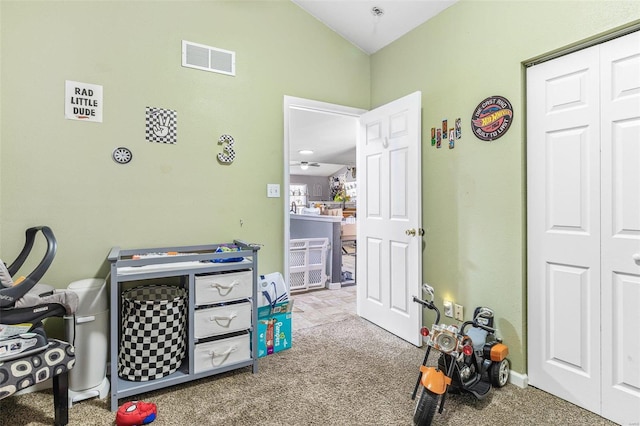 game room featuring lofted ceiling, carpet, and visible vents