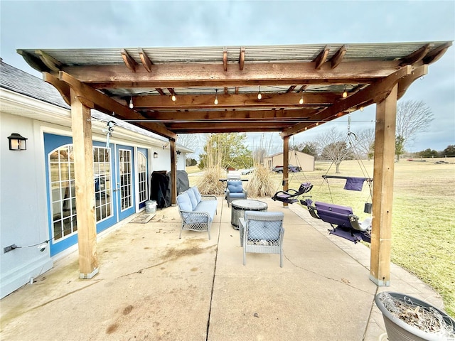 view of patio / terrace with a grill, a pergola, and french doors