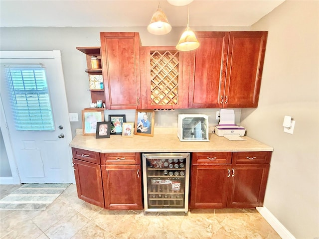 kitchen with open shelves, light countertops, hanging light fixtures, beverage cooler, and baseboards