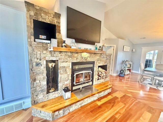 room details featuring wood finished floors, visible vents, and baseboards