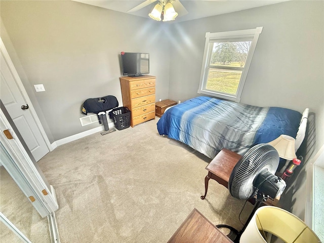 carpeted bedroom featuring baseboards