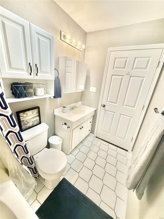 full bathroom with vanity and toilet