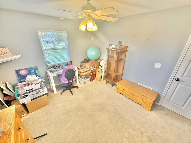 office space featuring ceiling fan and carpet floors