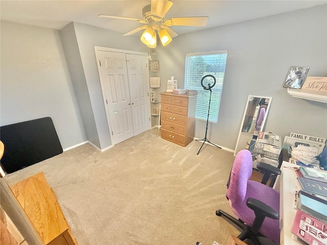 home office with carpet, baseboards, and ceiling fan