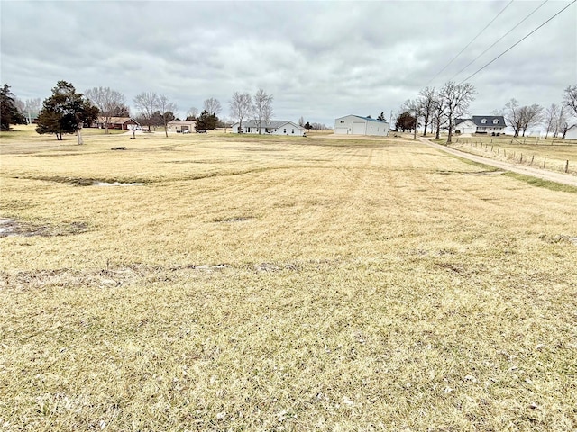 view of yard with a rural view