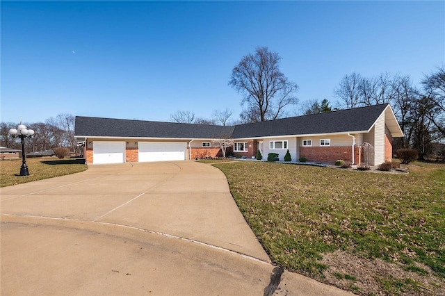 single story home featuring driveway, a garage, a front lawn, and brick siding