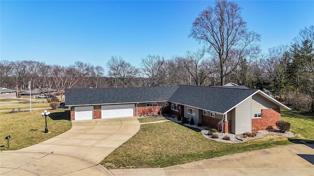 ranch-style house featuring an attached garage, a front yard, concrete driveway, and brick siding